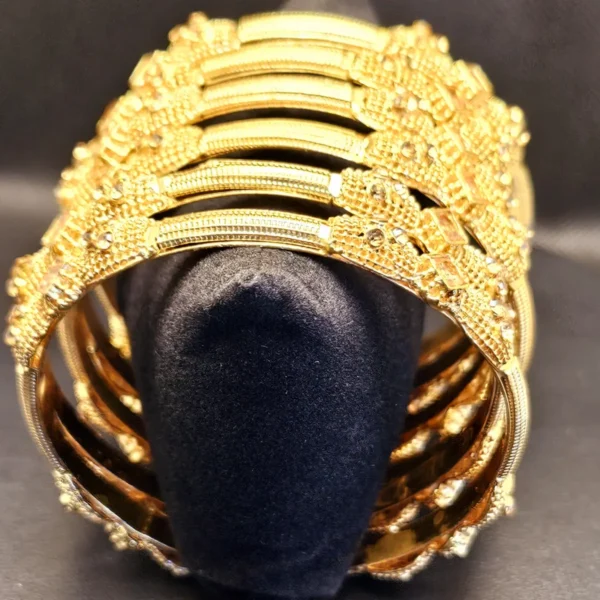 GOLD PLEATED BANGLES WITH CHAMPION CUT